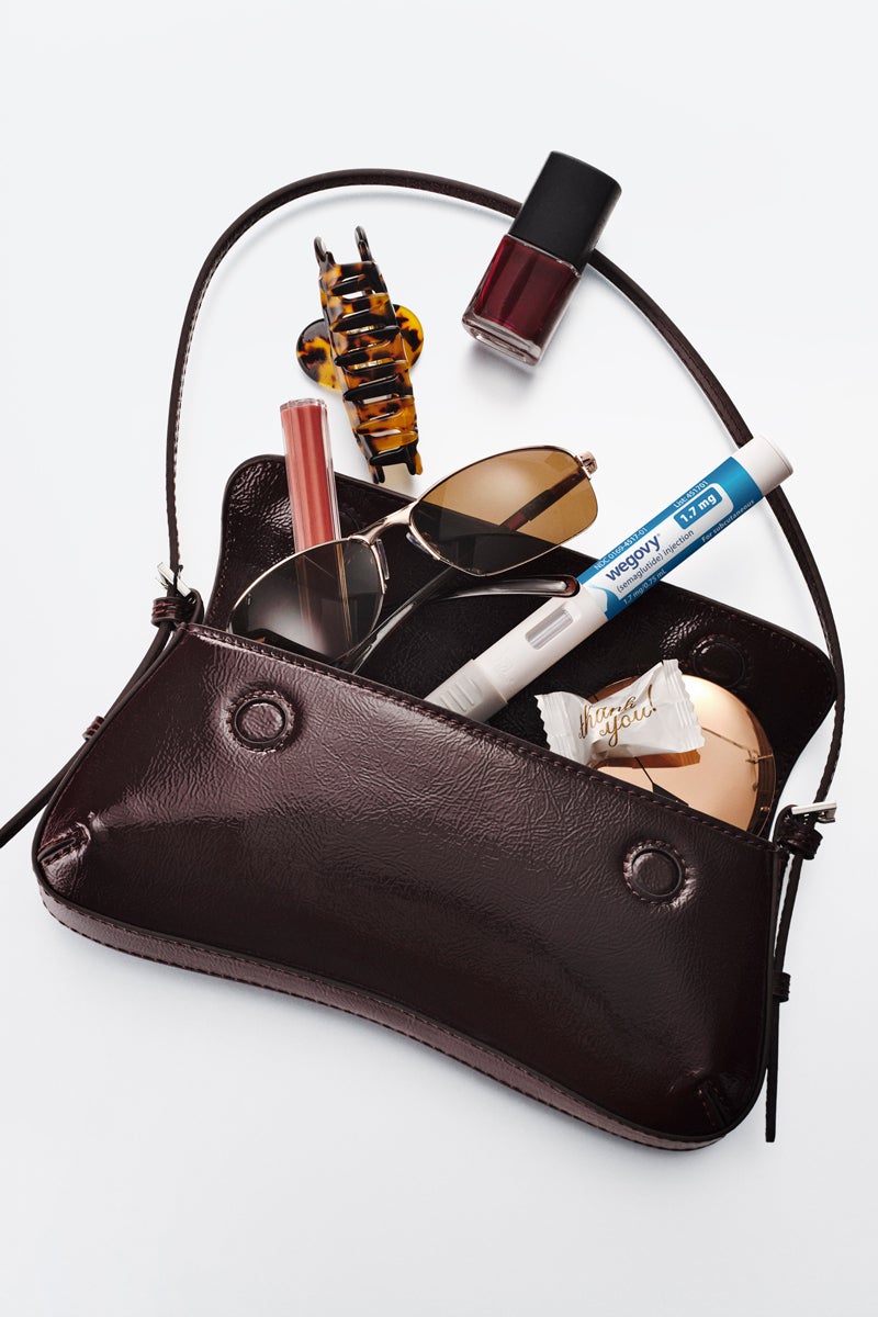 WeightWatchers medication pen and personal items in a handbag